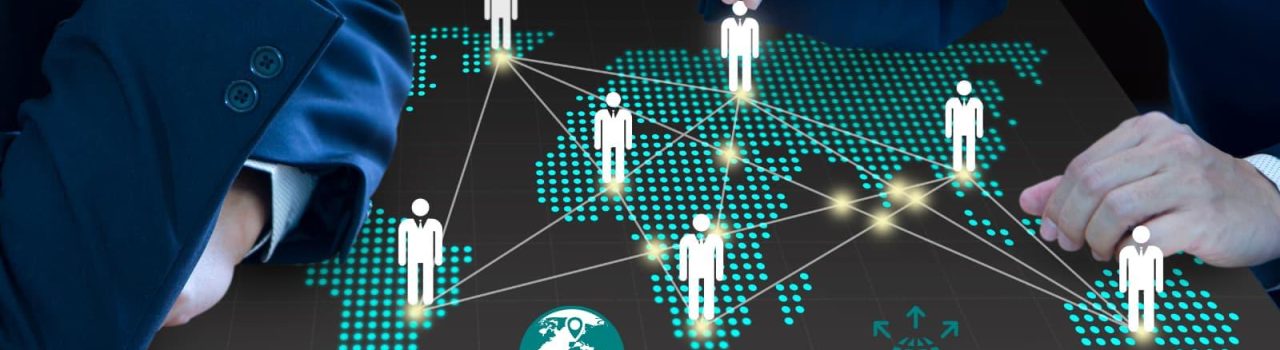 Multicultural business experts and our partners analyzing global market data on a map to craft a global expansion strategy