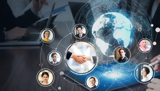 A diverse multicultural team from around the world working together with flags from various countries, symbolizing Ideal Extra Solutions' global reach and commitment to serving clients across different regions and cultures.