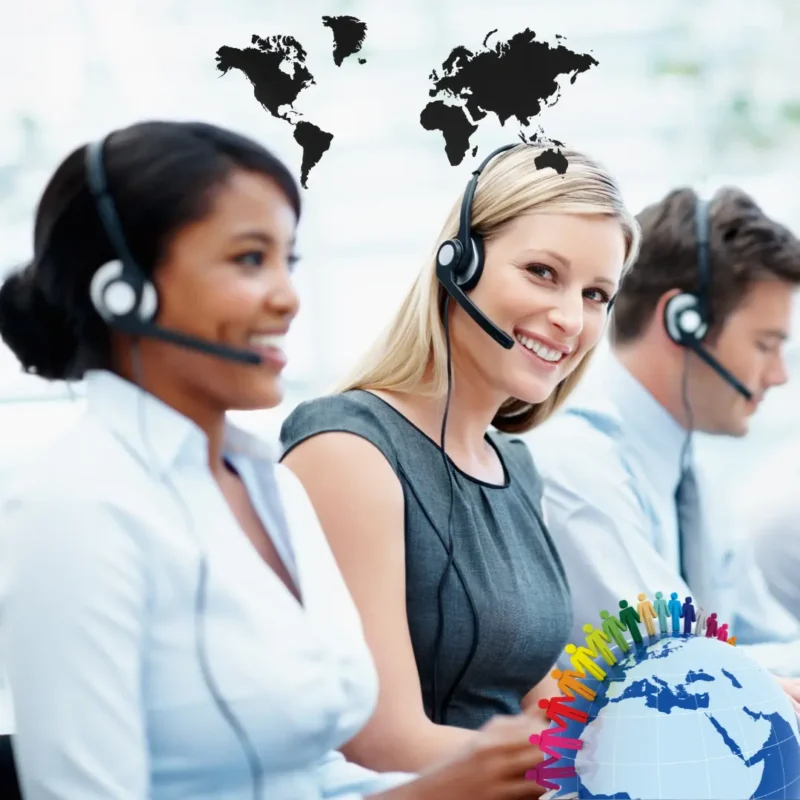 A multicultural business team In Ideal Extra Solutions office handling customer calls with professionalism, reducing churn by 30% through proactive retention strategies and personalized solutions.
